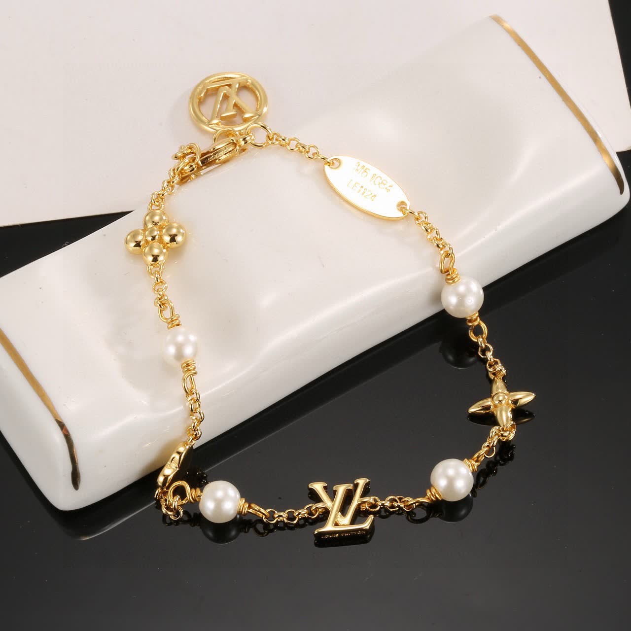 Louis Vuitton Gold Tone Bracelet with Pearls and Charms